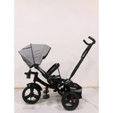 Tricicleta  plus 8 luni evolutiva, cu pozitie de somn, scaun rotativ si muzica distractiva, culoare GRI, BBD5099EVAG