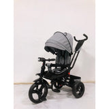 Tricicleta  plus 8 luni evolutiva, cu pozitie de somn, scaun rotativ si muzica distractiva, culoare GRI, BBD5099EVAG