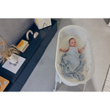 Patut balansoar, Lionelo, Coral, Cu landou ergonomic detasabil, Functie de balansare integrata, Functie de cantar, Sunete si cantece de leagan, Cu roti, Panou tactil sau telecomanda, 0-9 kg, EN 1130:2019+AC:2020,EN 16890:2017+A1:2021, Alb