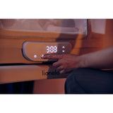 Patut balansoar, Lionelo, Coral, Cu landou ergonomic detasabil, Functie de balansare integrata, Functie de cantar, Sunete si cantece de leagan, Cu roti, Panou tactil sau telecomanda, 0-9 kg, EN 1130:2019+AC:2020,EN 16890:2017+A1:2021, Alb