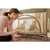 Patut pliant, Lionelo, Laura, 102 x 74 cm, Cu doua nivele, Functie de tarc, Cu roti, Include salteluta si geanta de transport, Pereti din plasa, Deschidere laterala, Pana la 15 kg, 0 luni +, Roz