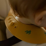 Baveta moale, Petite&Mars, Take&Match, Reglabil, Cu buzunar colector, Silicon, Fara BPA, 6 luni+, Model cactus, Galben