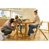 Scaun de masa multifunctional Celia, Lionelo, Din lemn de fag, 6 luni- adult, Reglabil pe inaltime, Spatar lat, Sezut ergonomic, Tavita silicon, Suport de picioare reglabil, Greutate maxima 90 Kg, Alb/Natural