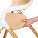 Scaun de masa multifunctional Celia, Lionelo, Din lemn de fag, 6 luni- adult, Reglabil pe inaltime, Spatar lat, Sezut ergonomic, Tavita silicon, Suport de picioare reglabil, Greutate maxima 90 Kg, Alb/Natural