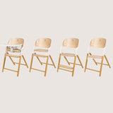 Scaun de masa multifunctional Celia, Lionelo, Din lemn de fag, 6 luni- adult, Reglabil pe inaltime, Spatar lat, Sezut ergonomic, Tavita silicon, Suport de picioare reglabil, Greutate maxima 90 Kg, Alb/Natural