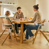 Scaun de masa multifunctional Celia, Lionelo, Din lemn de fag, 6 luni- adult, Reglabil pe inaltime, Spatar lat, Sezut ergonomic, Tavita silicon, Suport de picioare reglabil, Greutate maxima 90 Kg, Alb/Natural